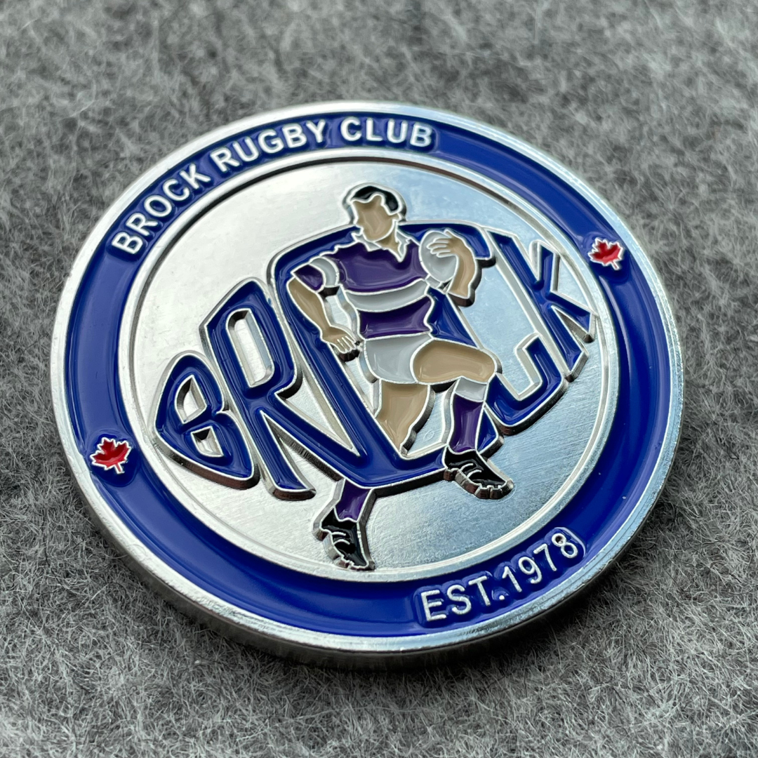 Sports challenge coin for rugby club with a sportsment running and holding a ball