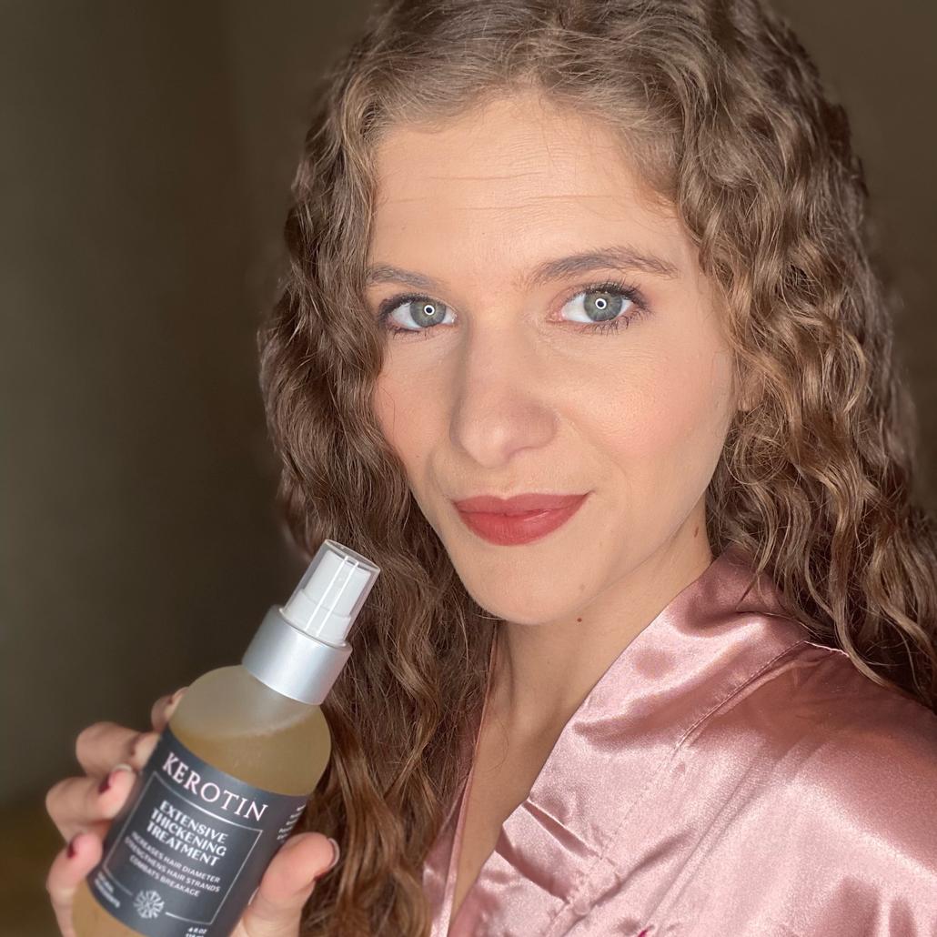 Model With Long Blond Hair Holding a Bottle of Kerotin Vitamins