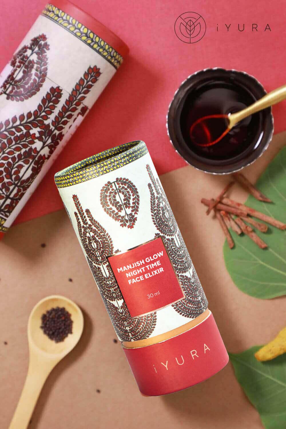 Beautiful shots of Manjish Glow Elixir's Madhubani cylinders - also shown is a copper bowl with the oil poured out.
