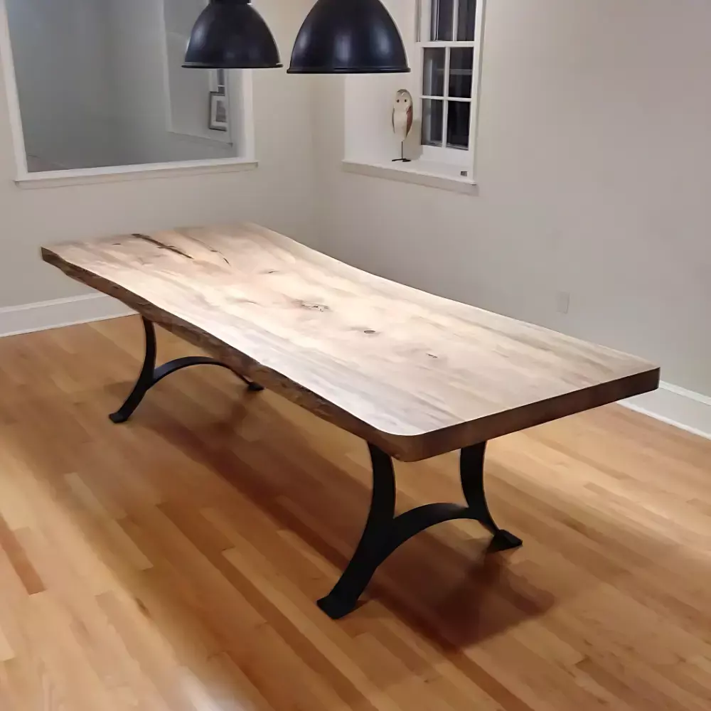 Ash wood live edge conference table with black steel legs in minimalist meeting room