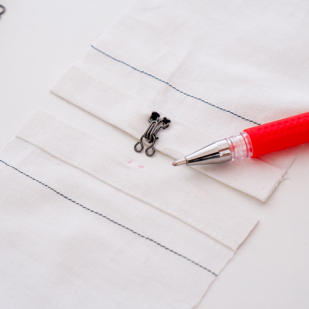 Use a temporary fabric marker to position the eye of the hook and eye set
