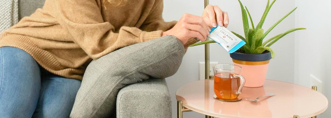 Woman adding DeepMarine Collagen Peptides to her tea