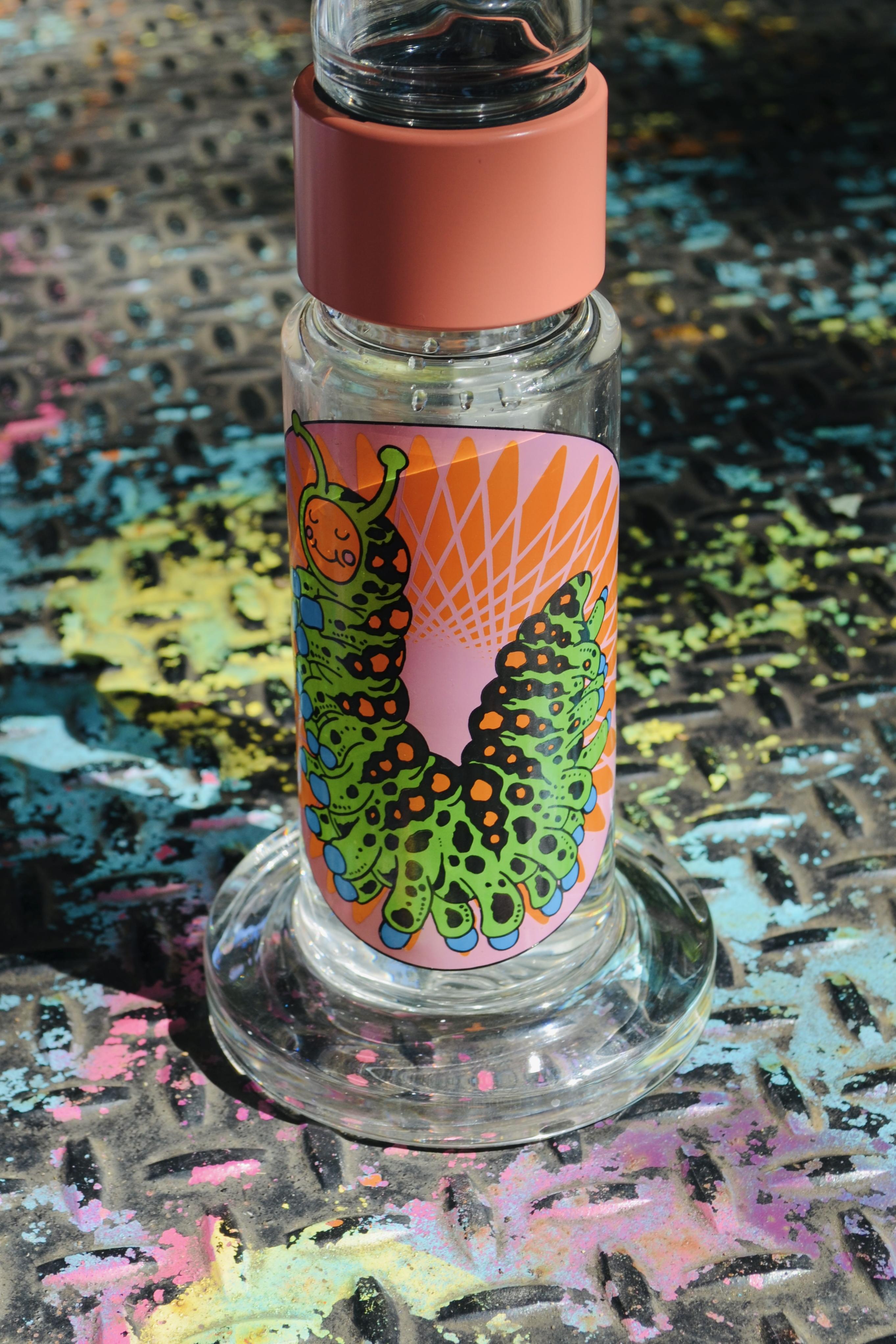 An image of a Prism Big Honeycomb base with the Pond Life decal on the base and a coral colored halo connector