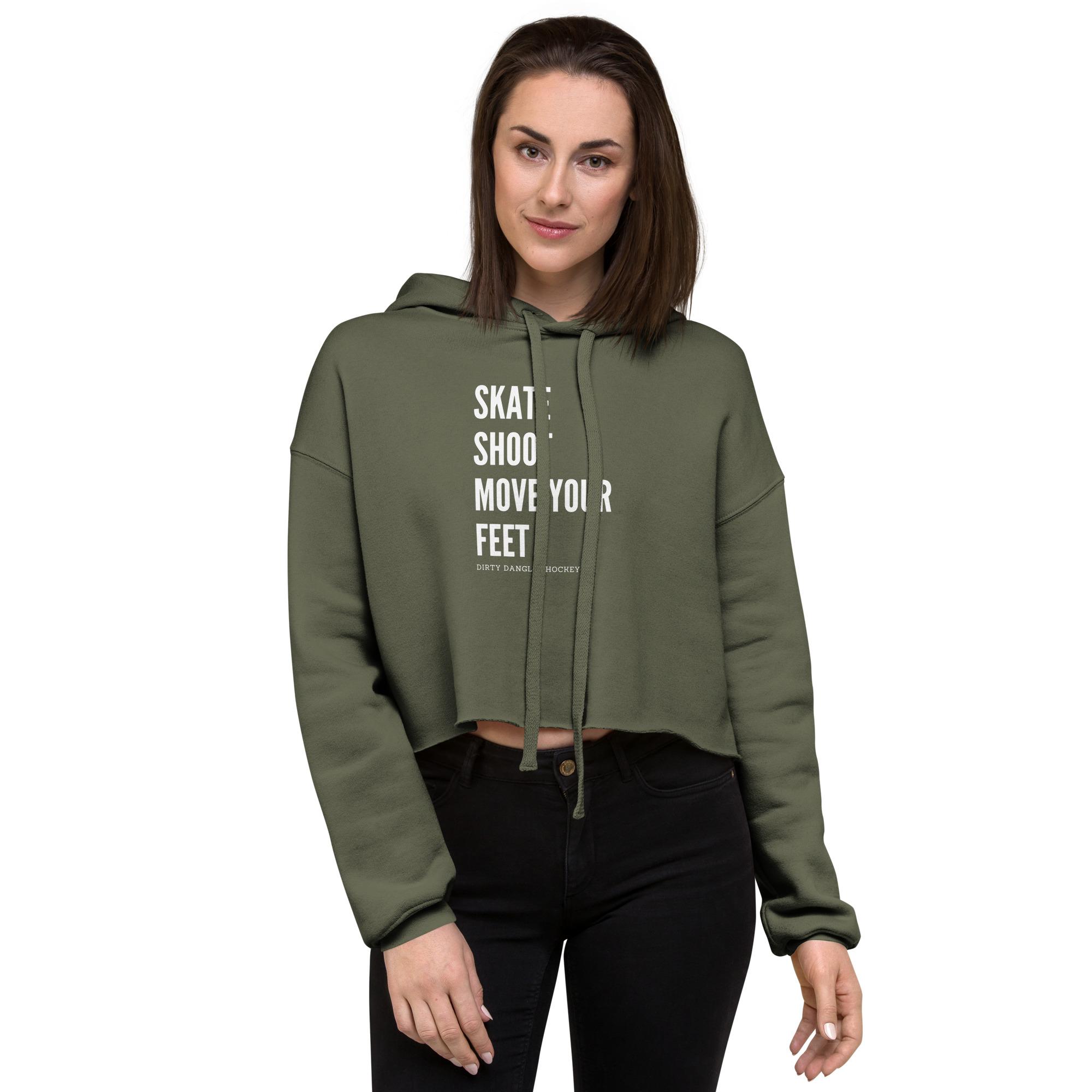 A hockey mom wearing a green skate shoot move your feet crop hoodie