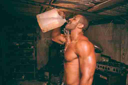 man chugging a gallon of water hydration