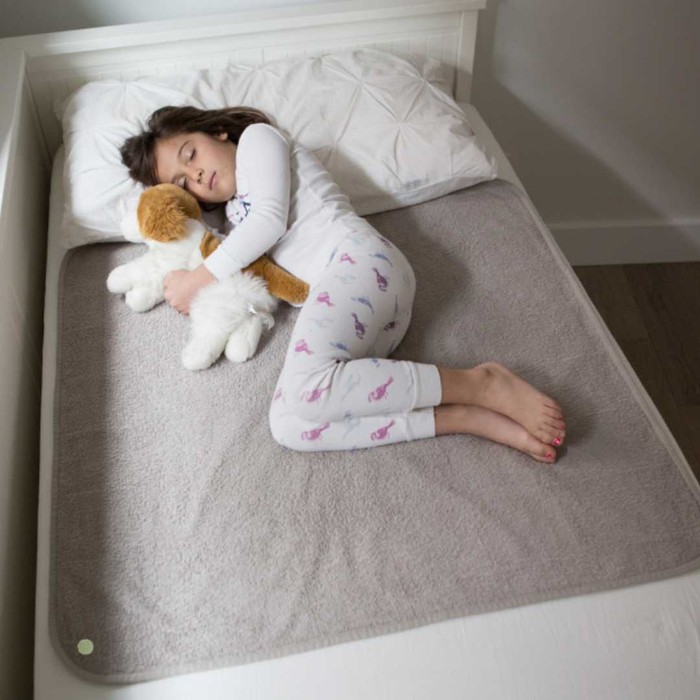 Girl sleeping on bedwetting mat PeapodMat