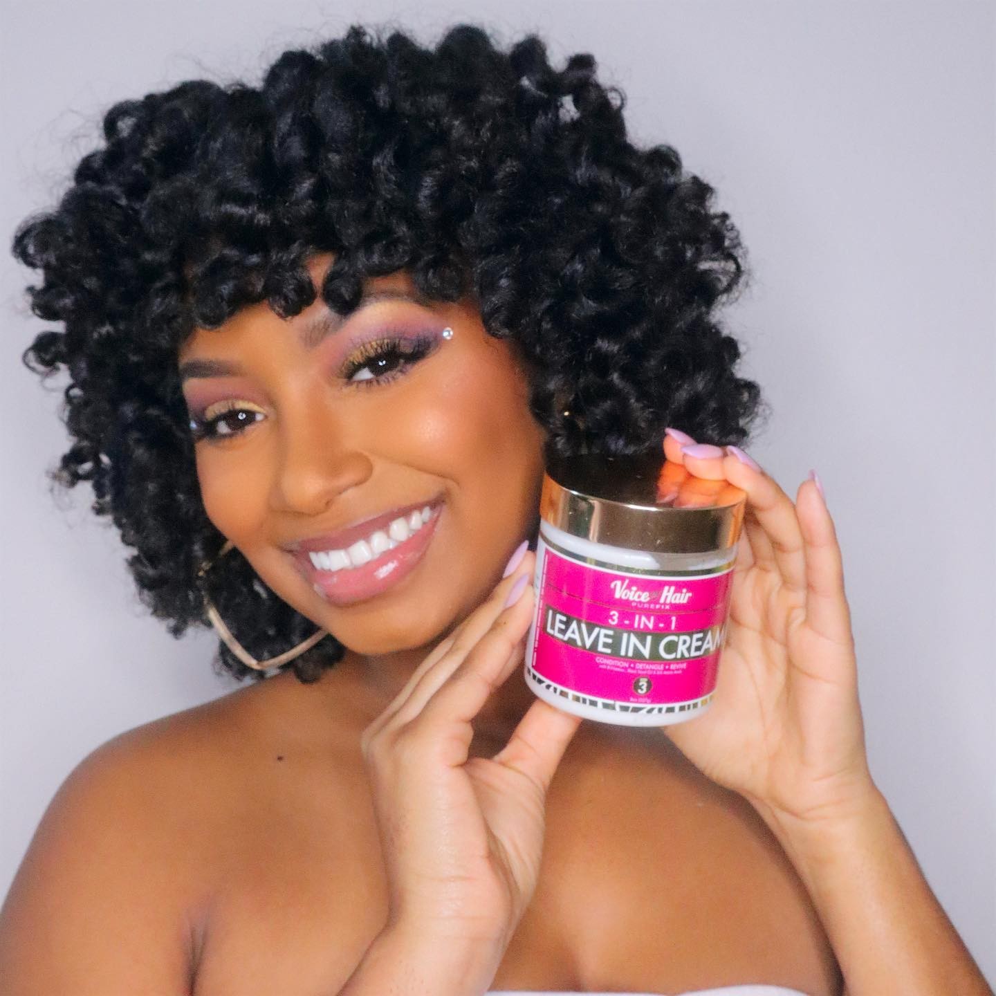black woman with natural hairstyle smooth & bouncy flexi rod curls