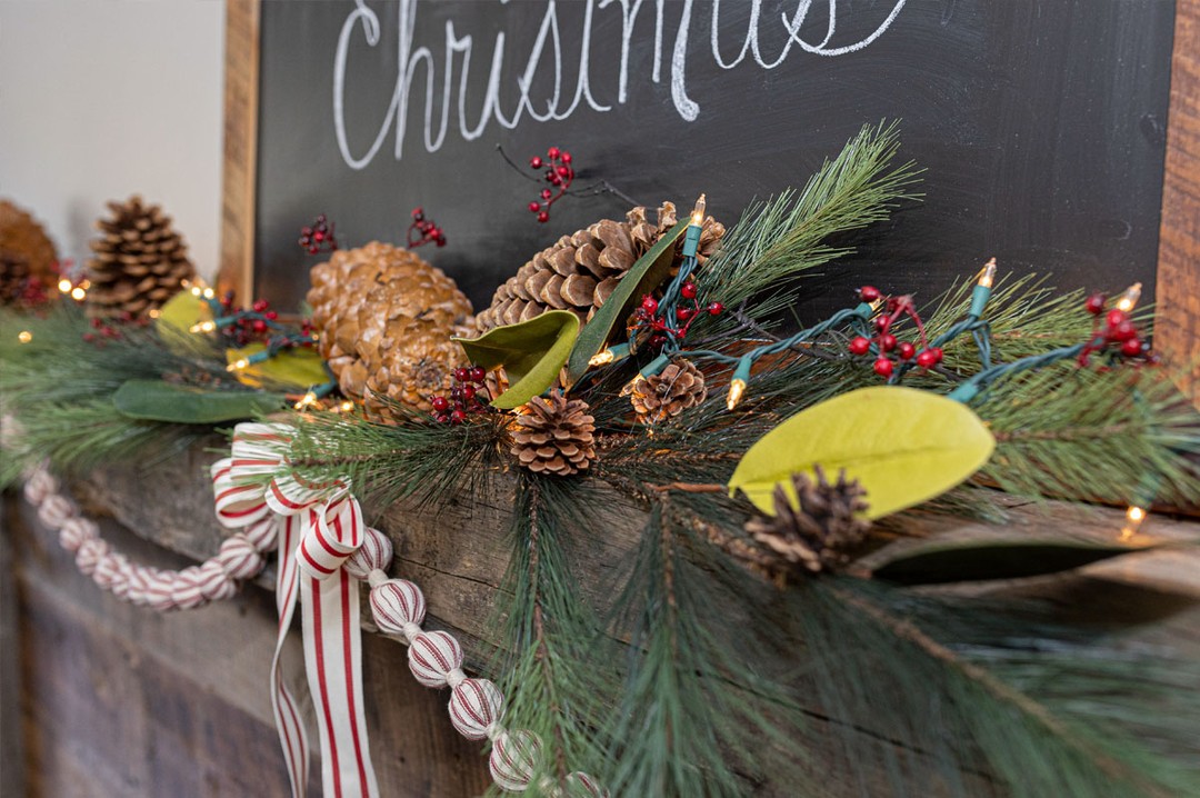decorated fireplace mantel for Christmas with chalkboard