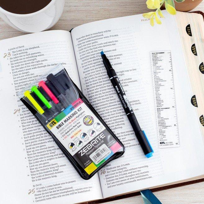 open Bible with different types of highlighters and ruler with books of the Bible