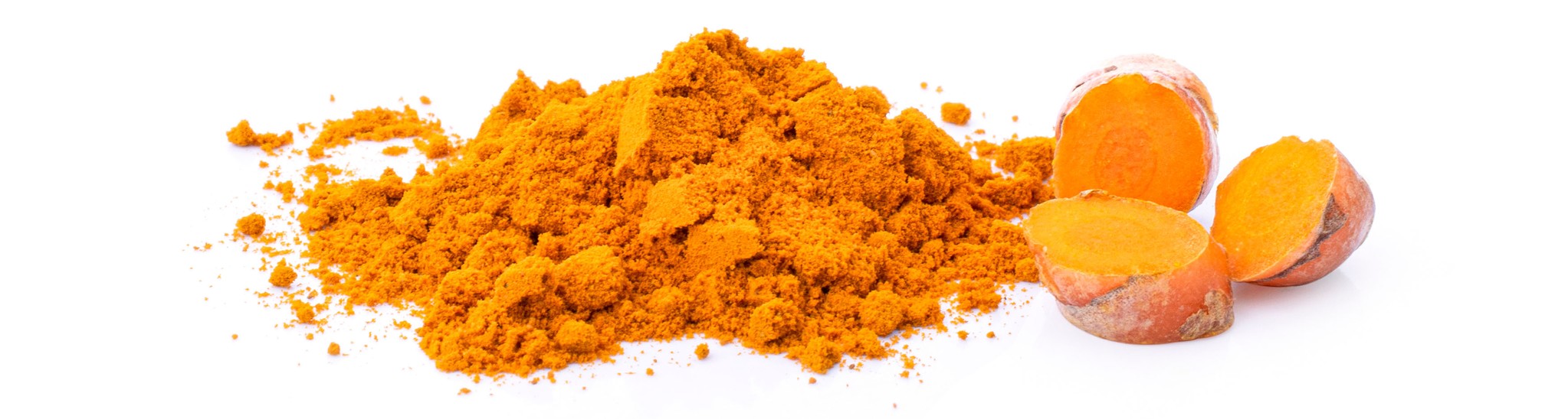 A pile of turmeric powder with 3 hunks of chopped turmeric root to the right of the pile