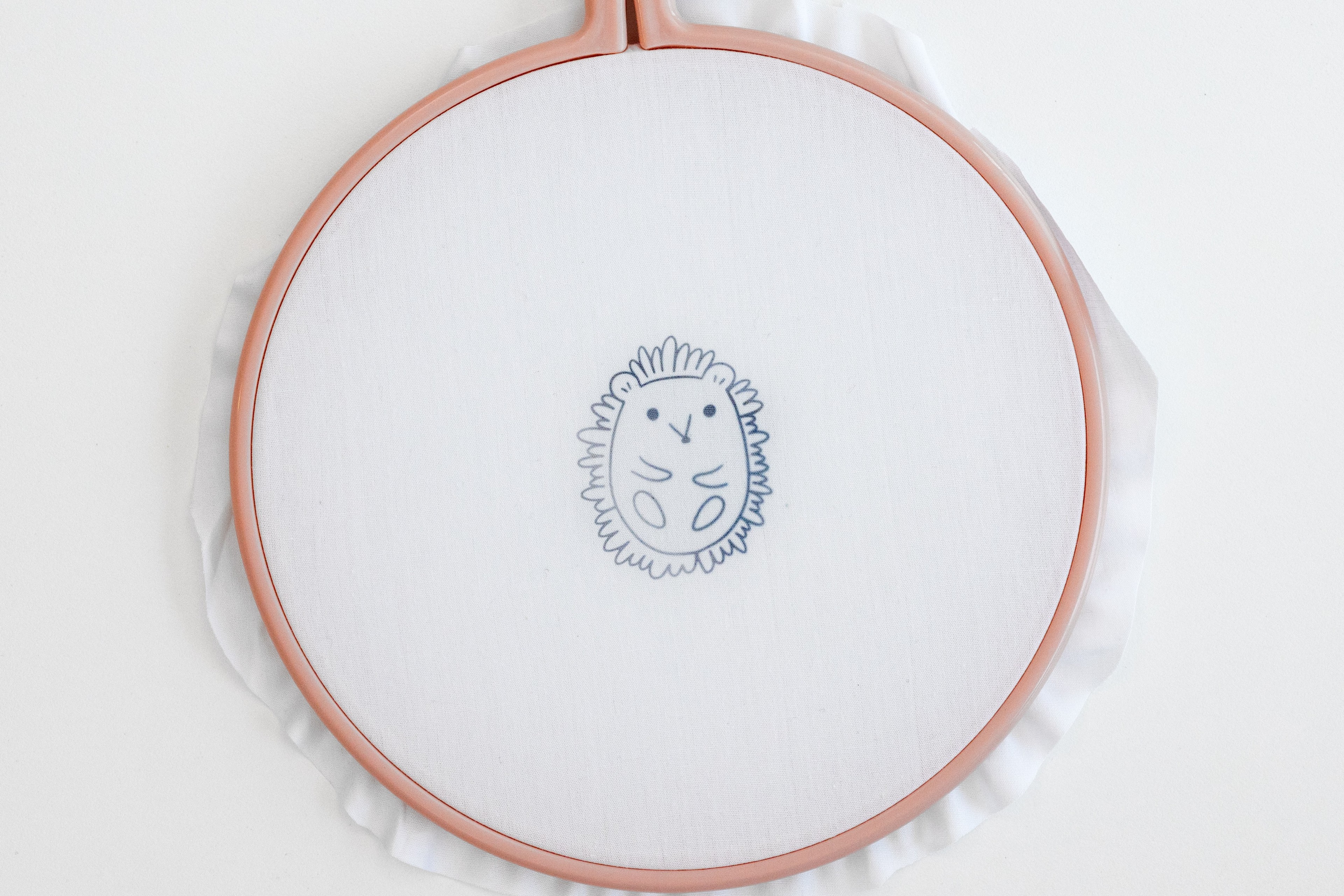 A hedgehog pattern has been transferred onto the hoop.