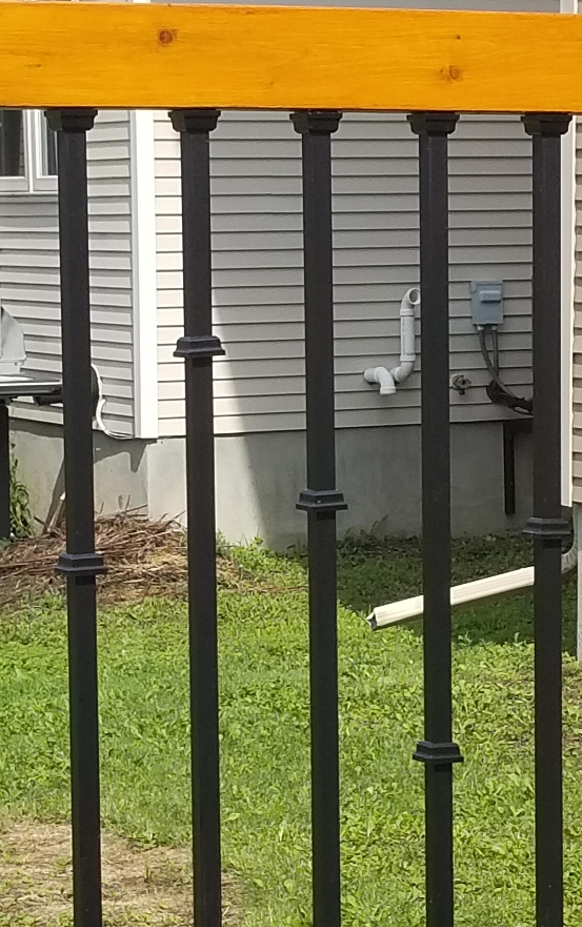 stunning faded wood boardwalk with beautiful lawn and pool in the background