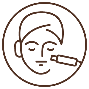 A face receiving a cosmetic treatment with a microneedling device.