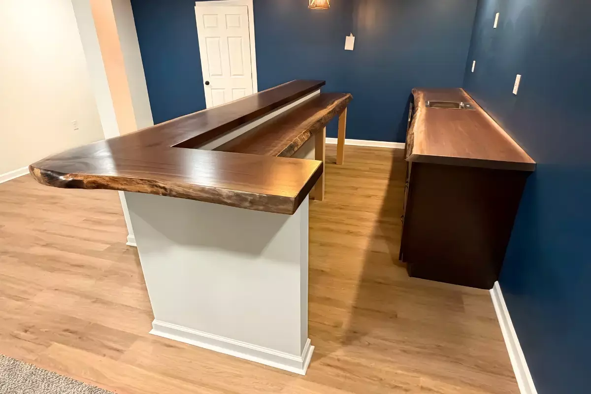 Custom live edge walnut bar and countertop installed in finished basement