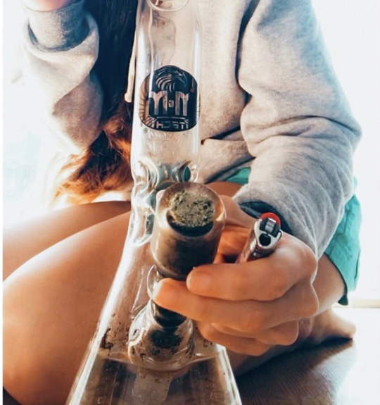 woman smoking a bong