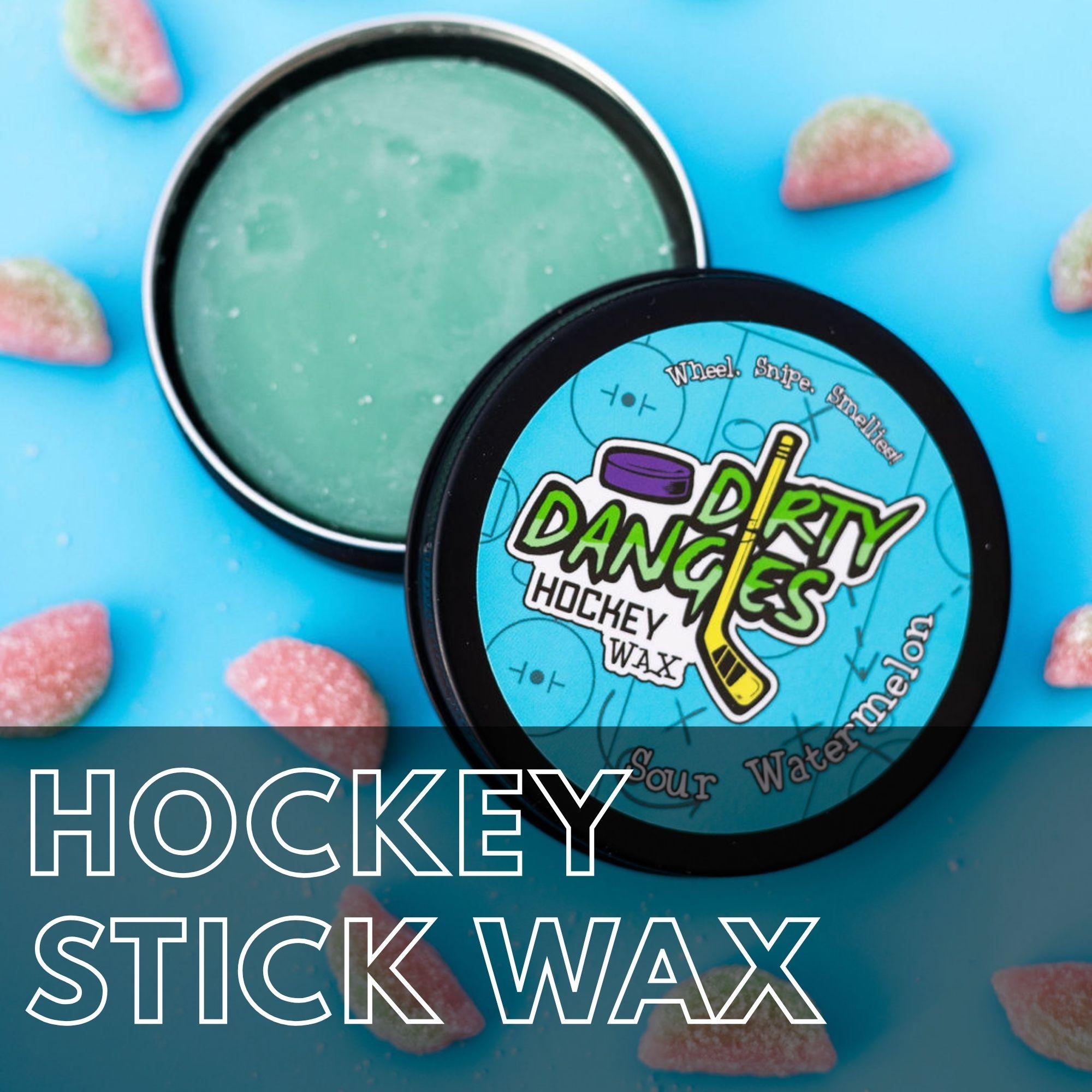 Dirty Dangles hockey stick wax tin displayed with sour watermelon candies. Hockey Stick Wax