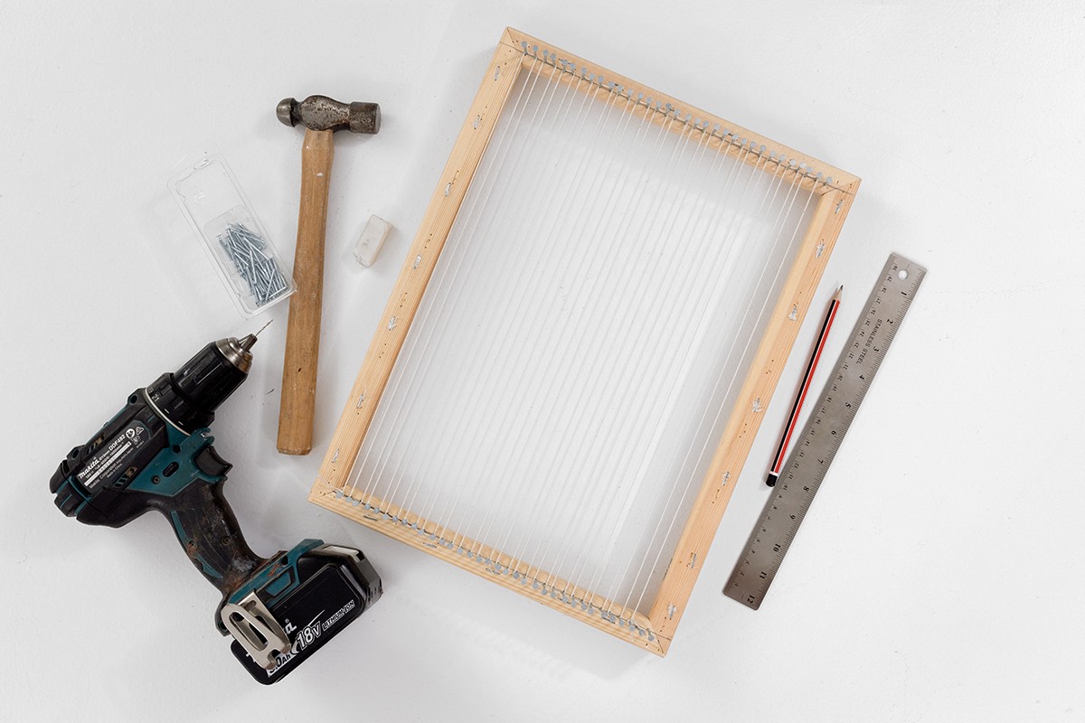 This image shows the supplies needed to make a DIY Frame Loom.