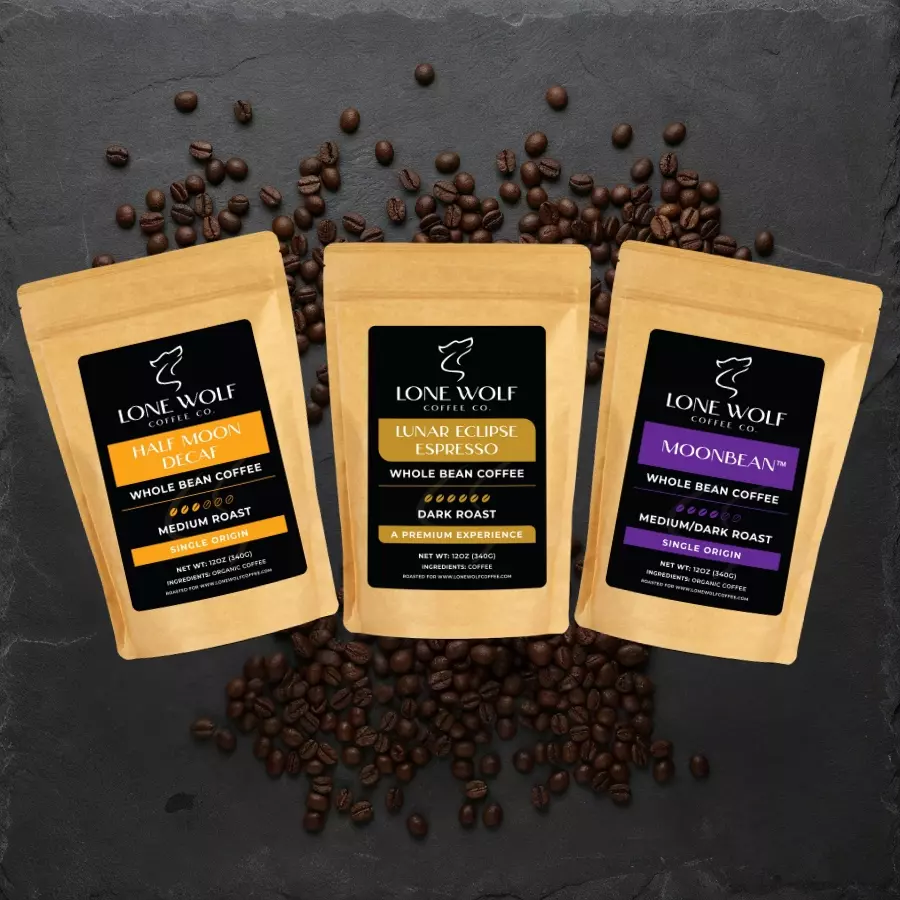 Lone Wolf Coffee best-selling whole bean coffee bags displayed on a dark background with scattered beans.