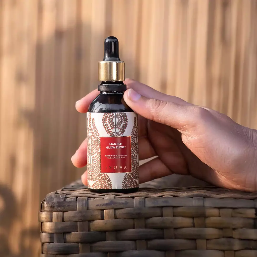 hand with manjish bottle 1