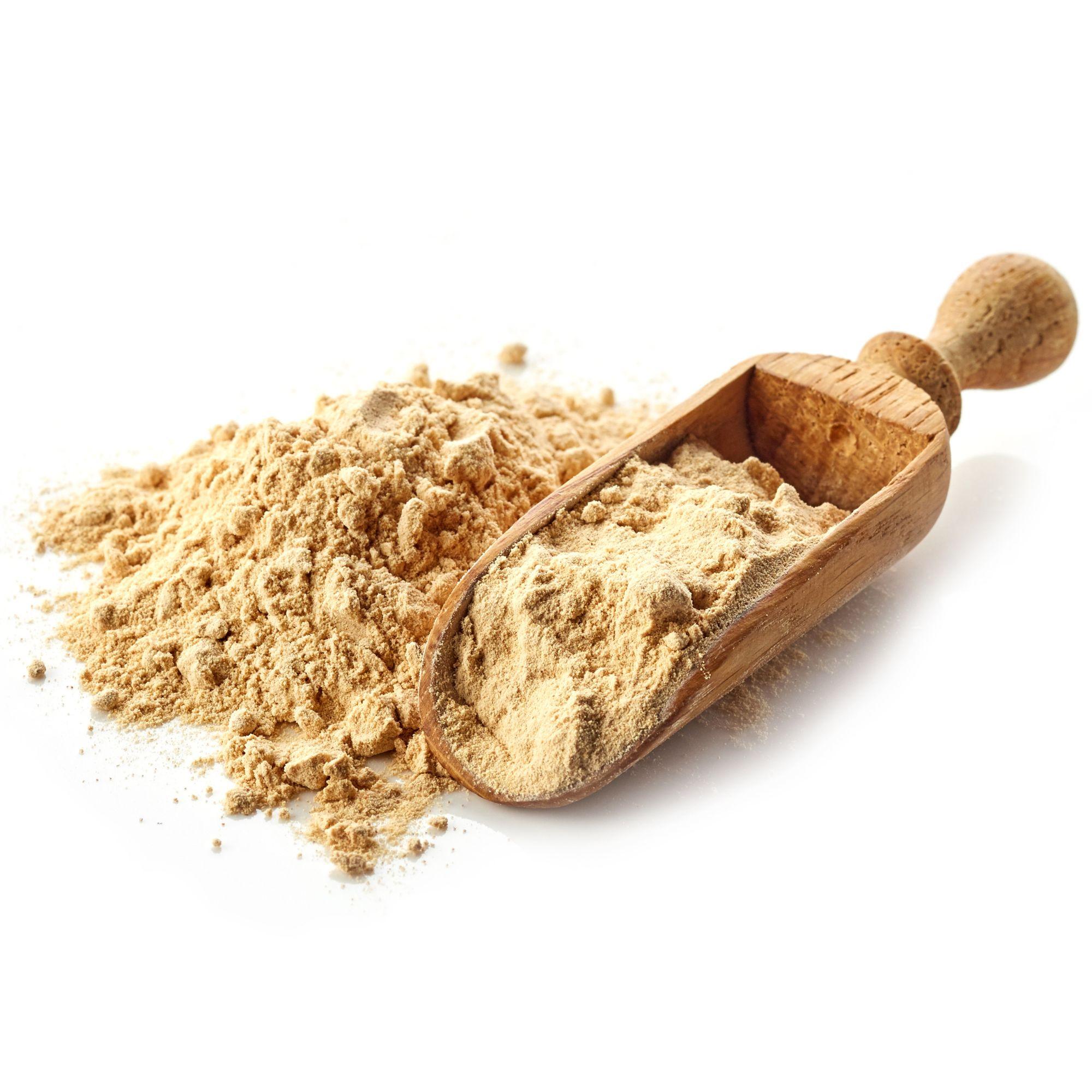Aerial view of a box of Herbal Roots Apple Cider Vinegar with a small plate of the capsules on the right and a red apple of the left. In the upper left corner is a small bowl of cayenne pepper powder