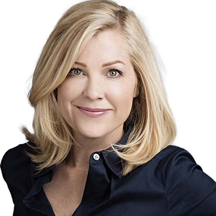 actress Jennifer Aspen smiling, on a white background