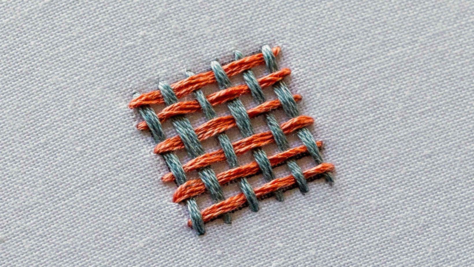 A finished shape completely filled with weave stitch