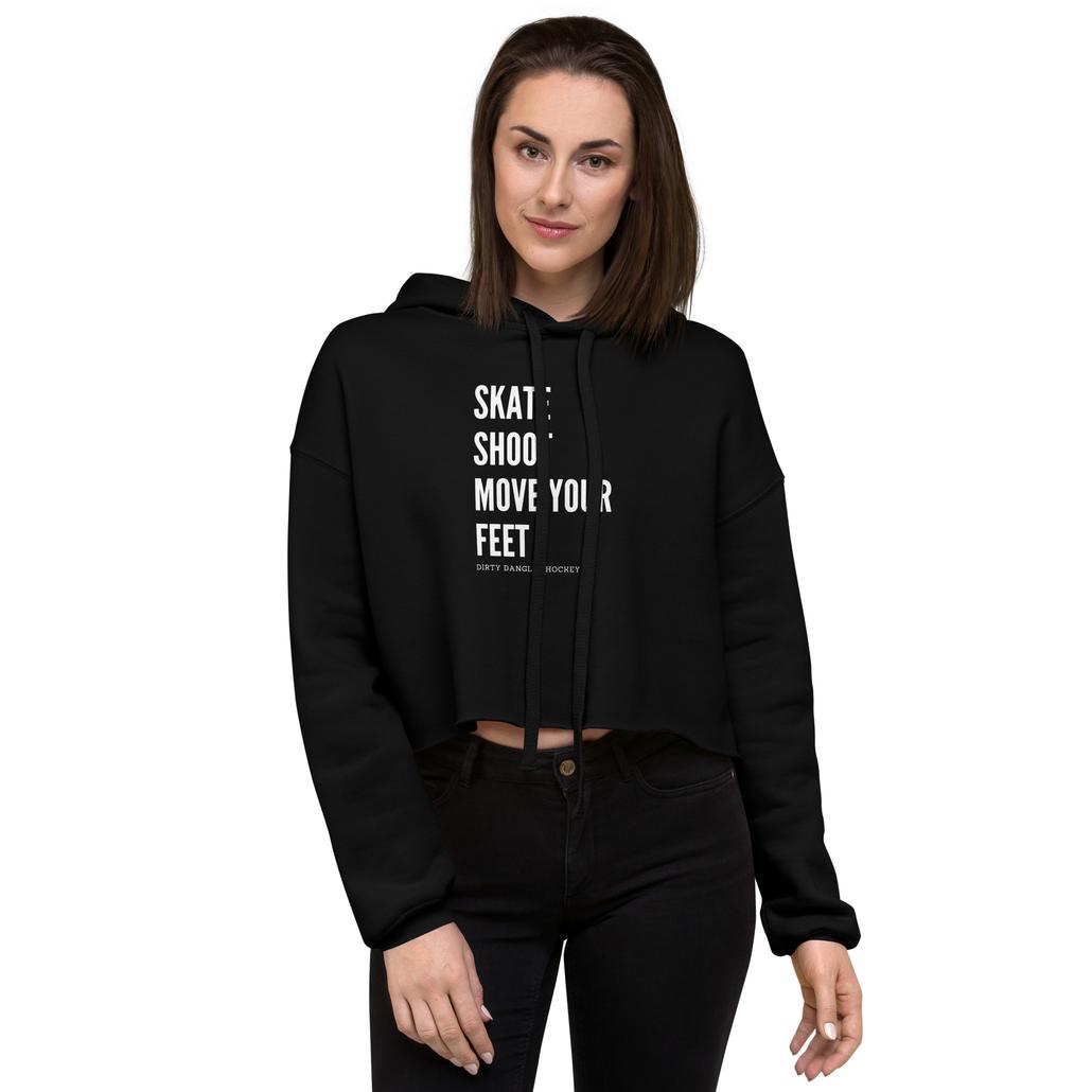 A hockey mom in a black crop hoodie. Skate shoot move your feet