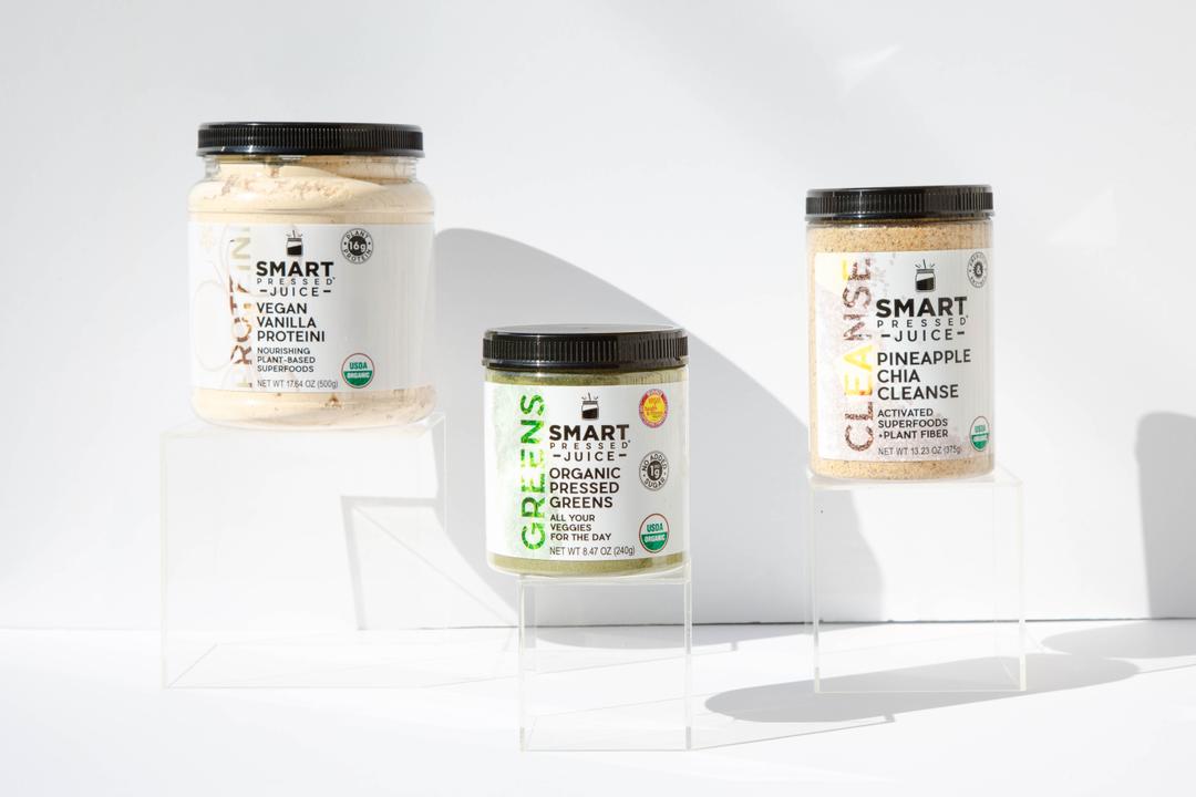 Jars of Maintenance Cleanse package on stands