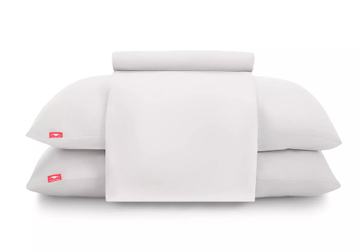Two white pillows and a bed sheet made from cooling materials sleep gift set.