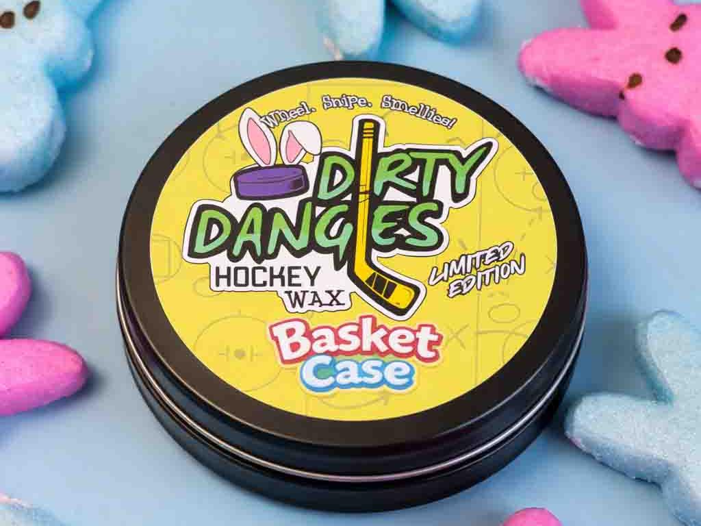 Dirty Dangles Hockey Wax Basket Case marshmallow candy scented hockey wax surrounded by colorful marshmallow Peeps on a light blue background