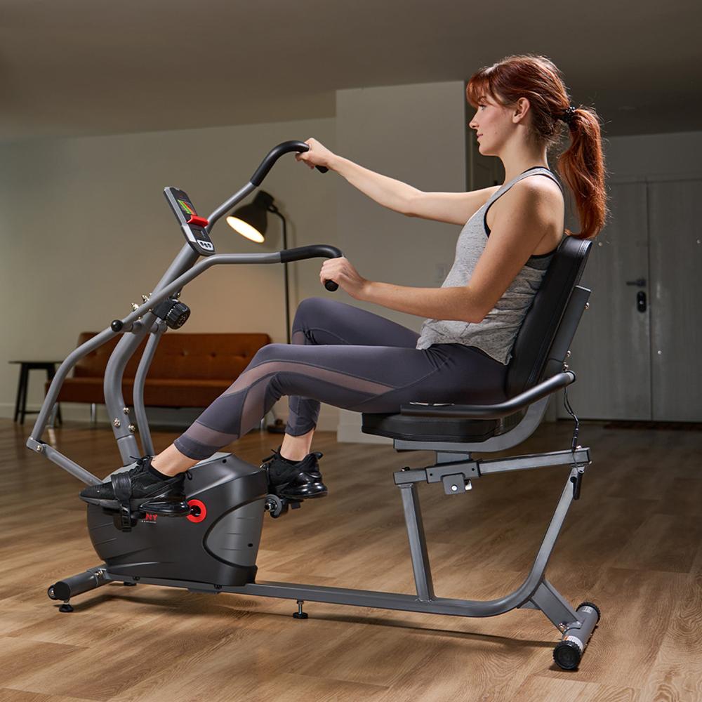 women cycling on recumbent bike