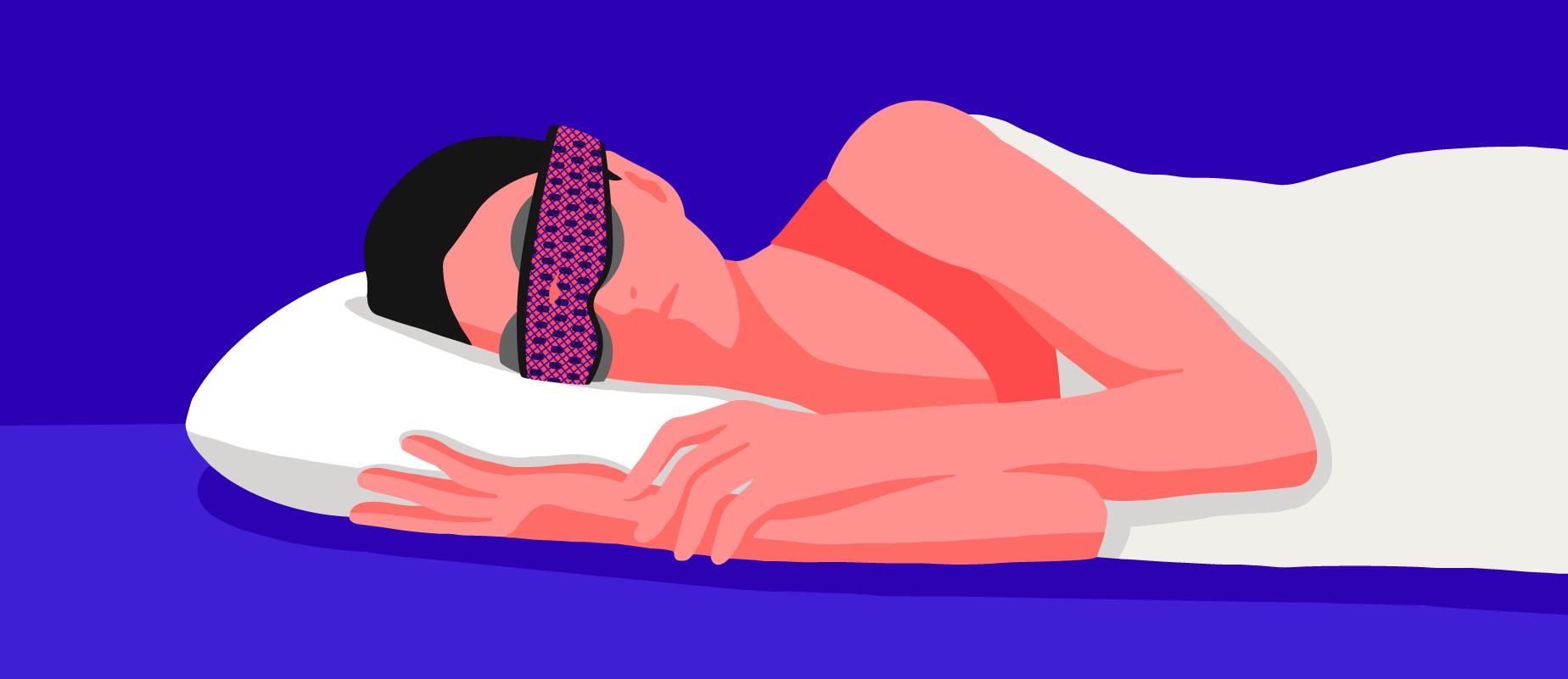 A female sleeping on her side wearing the best sleep mask for side sleepers.