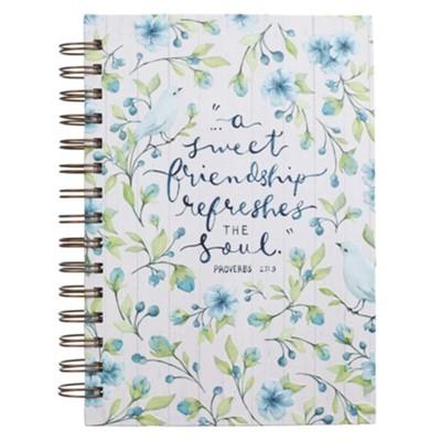 Light blue and green floral journal, text in center says "A sweet friendship refreshes the soul"