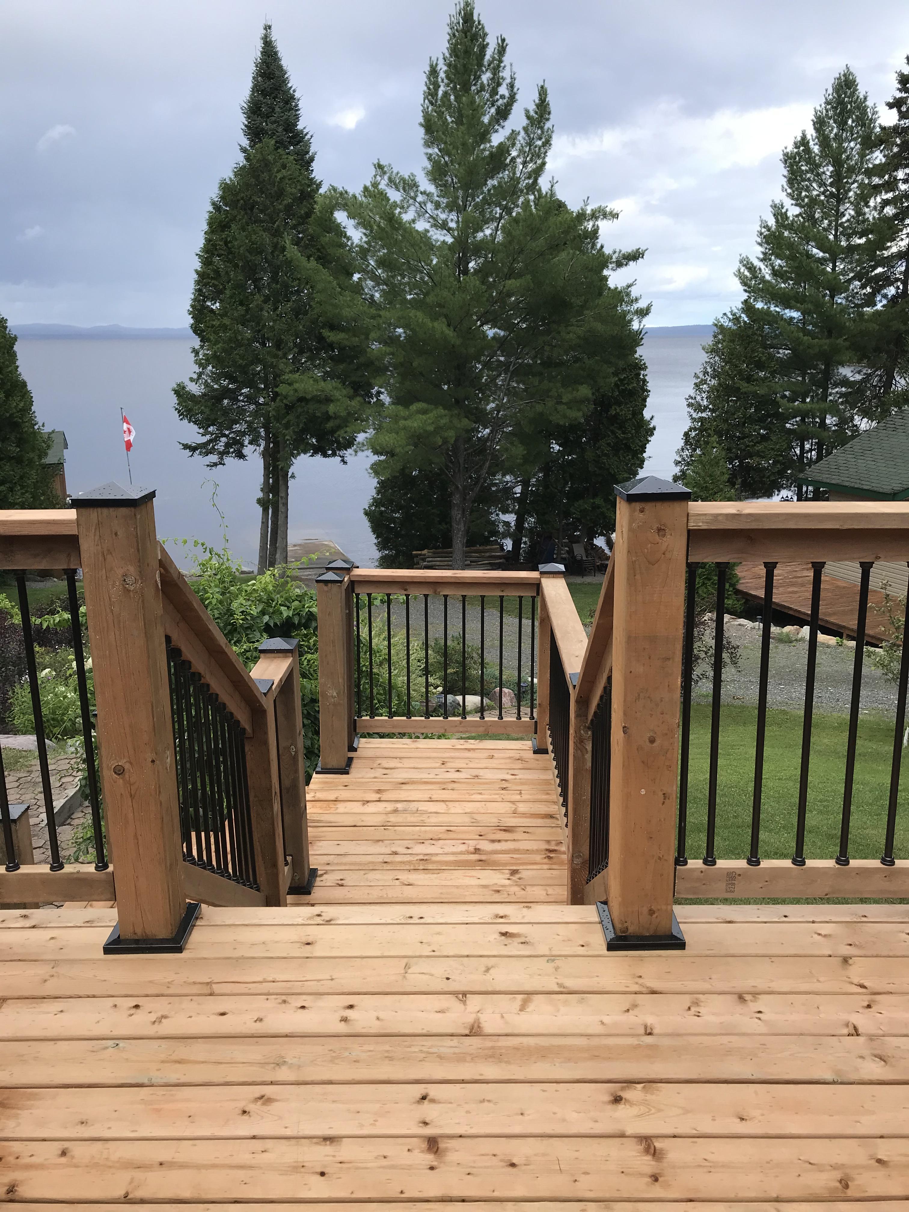 framed deck attached to pool using deck foot anchors