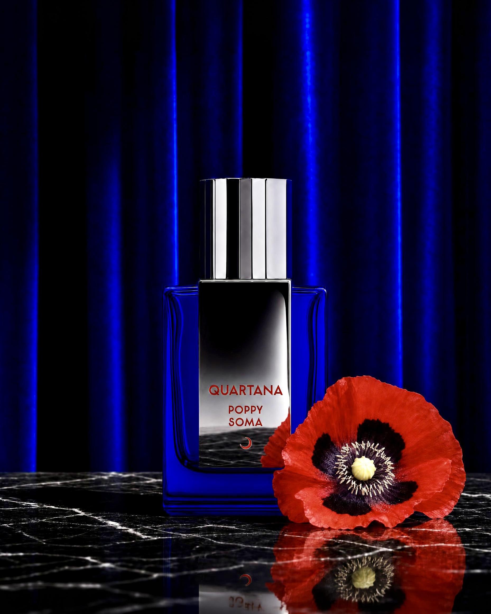 Poppy Soma Bottle in front of a blue curtain with poppy flower