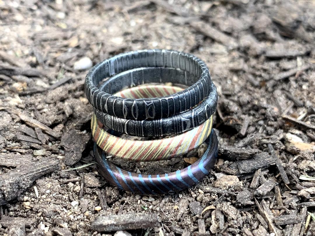 Stackable wedding rings can be made in a variety of materials, including but not limited to Gold, Mokume Gane, Timascus, and Damascus Steel