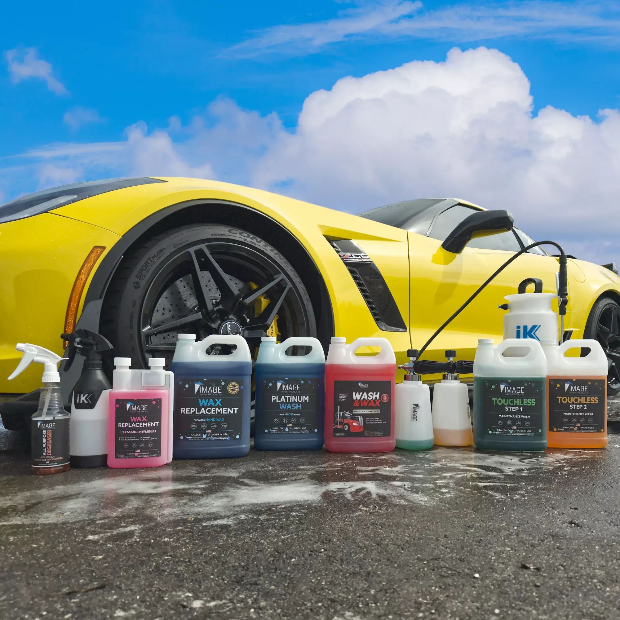 Various detailing chemicals by Image Wash Products in front of a clean and shiny yellow Corvette sports car.