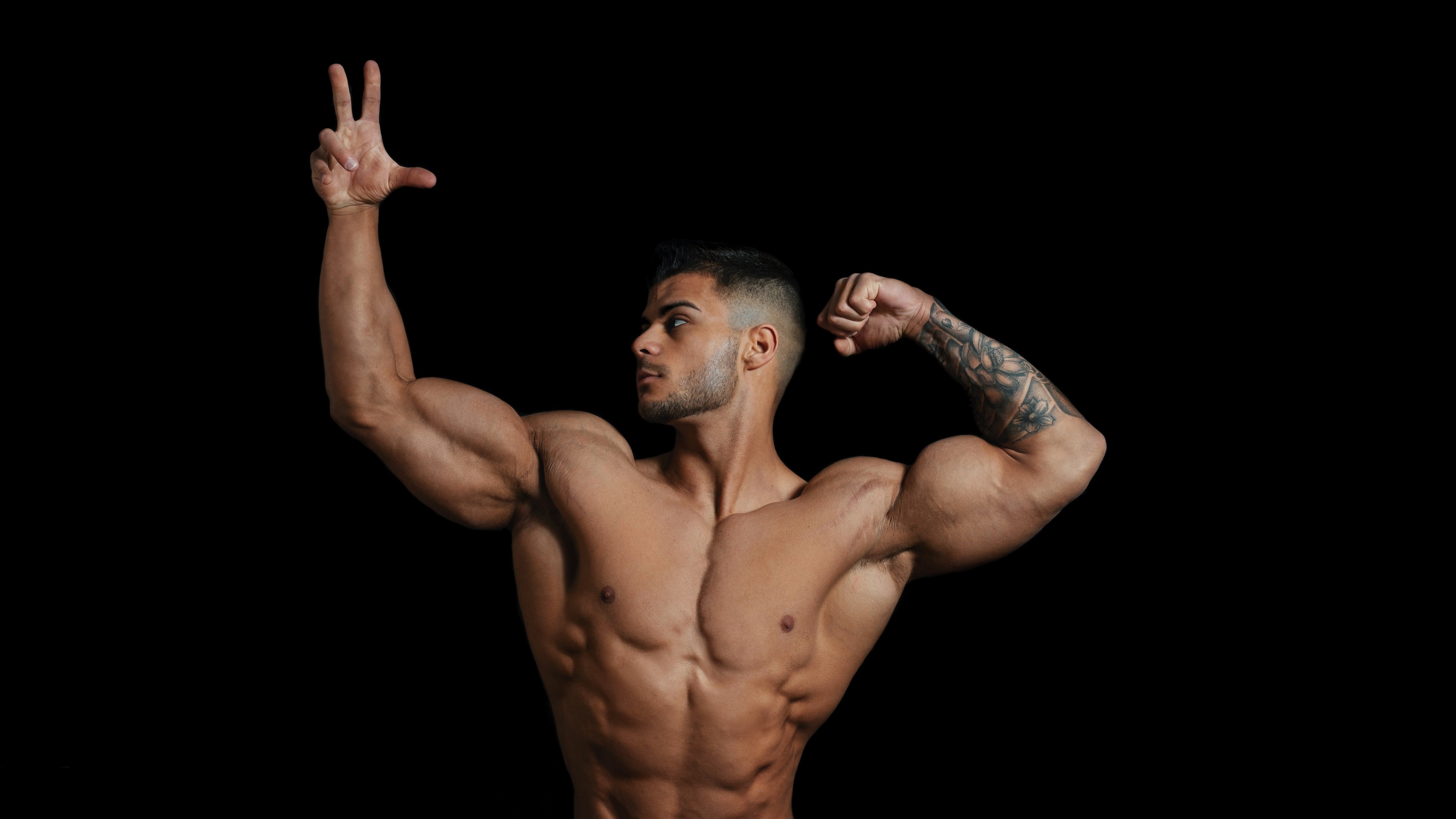 Man flexing and posing, upper body strength
