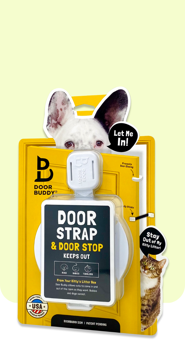 Door Buddy Door Strap and Door Stop product packaging displayed with a dog illustration saying Let Me In and a cat graphic saying Stay Out of My Kitty Litter. The packaging highlights that the adjustable door strap keeps dogs babies and toddlers out while allowing cats to move freely between rooms.