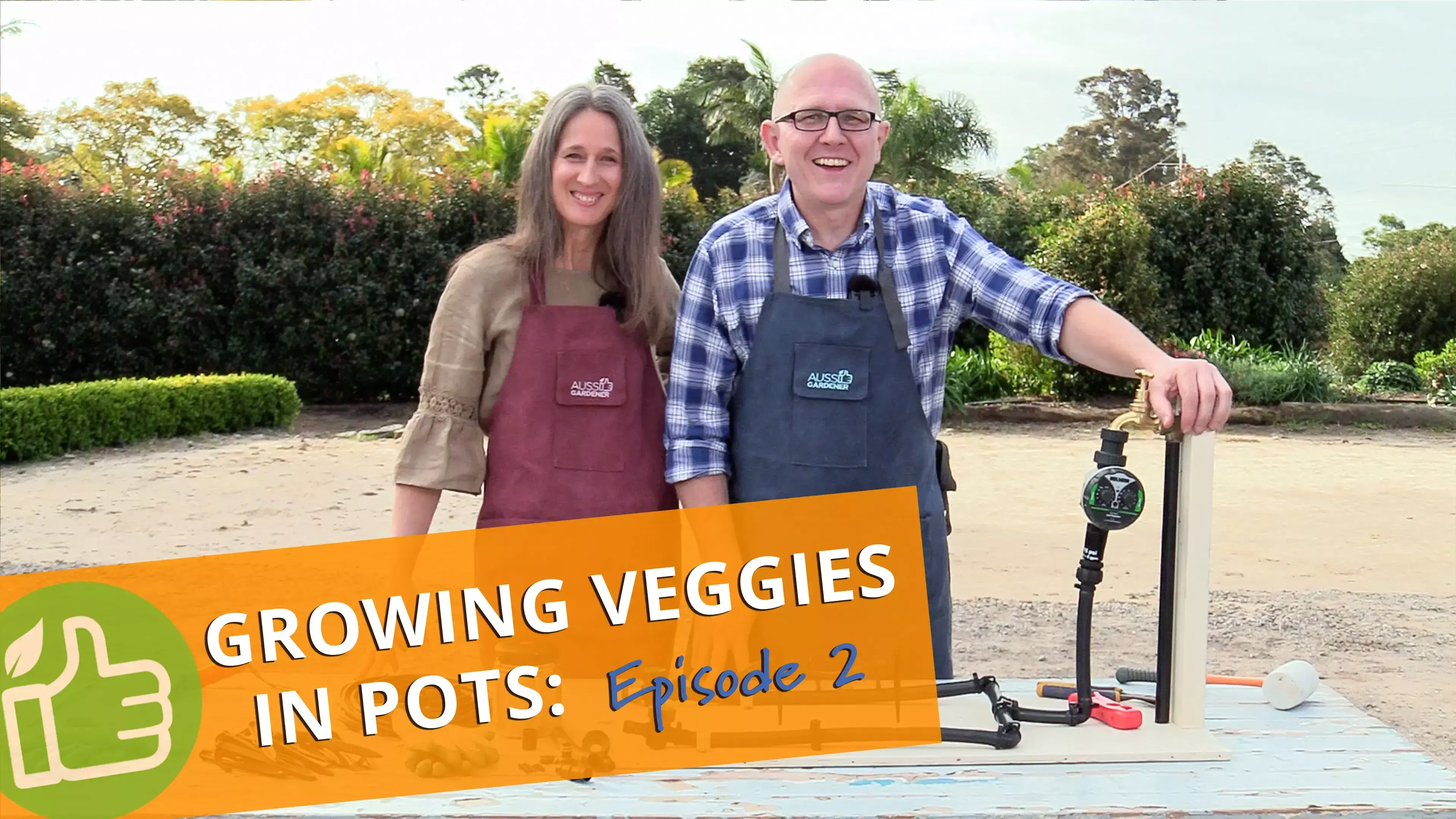 Episode 2 of Growing Veggies in Pots with Brian and Kaylene standing outdoors beside irrigation setup.