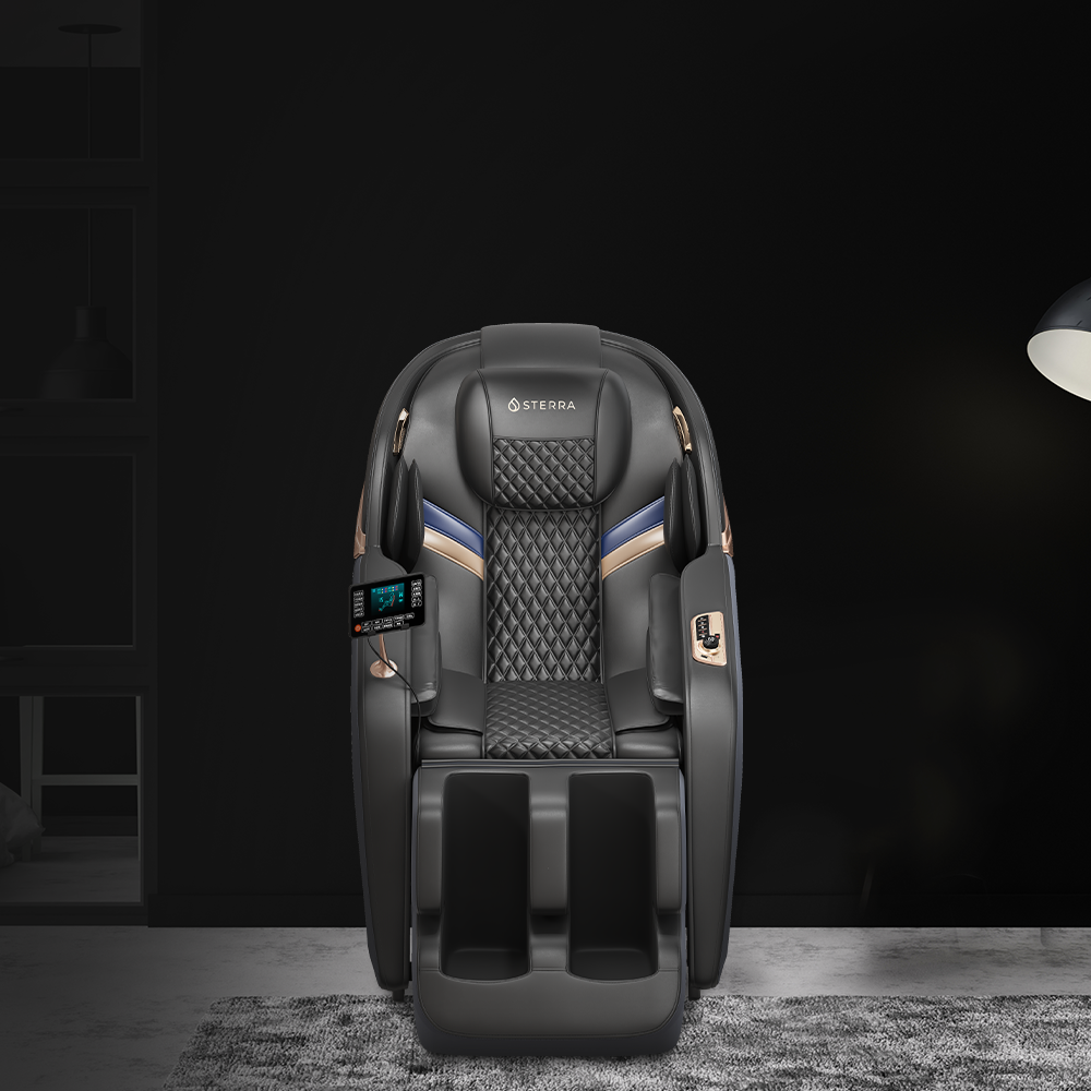 Black massage chair with multiple controls and a quilted design, positioned in a dark, modern room.