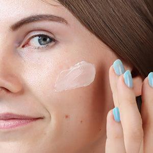 Massaging cream into cheek