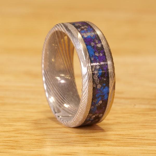 The Nebula Twist Damascus Glowstone Ring is a Damascus Steel Wedding Ring