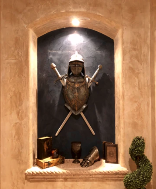 knight's armour and sword displayed in leah's home