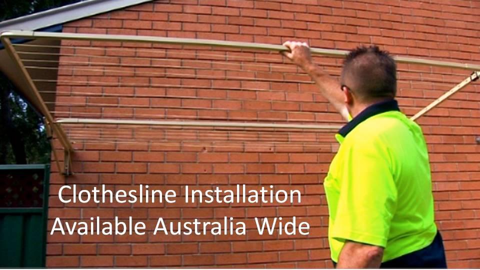 2000mm wide clothesline installation service showing clothesline installer with clothesline installed to brick wall