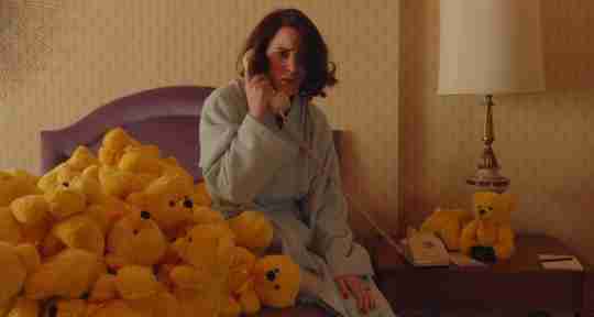 Mrs. Maisel on the phone surrounded by Yellow Colorama Bears.