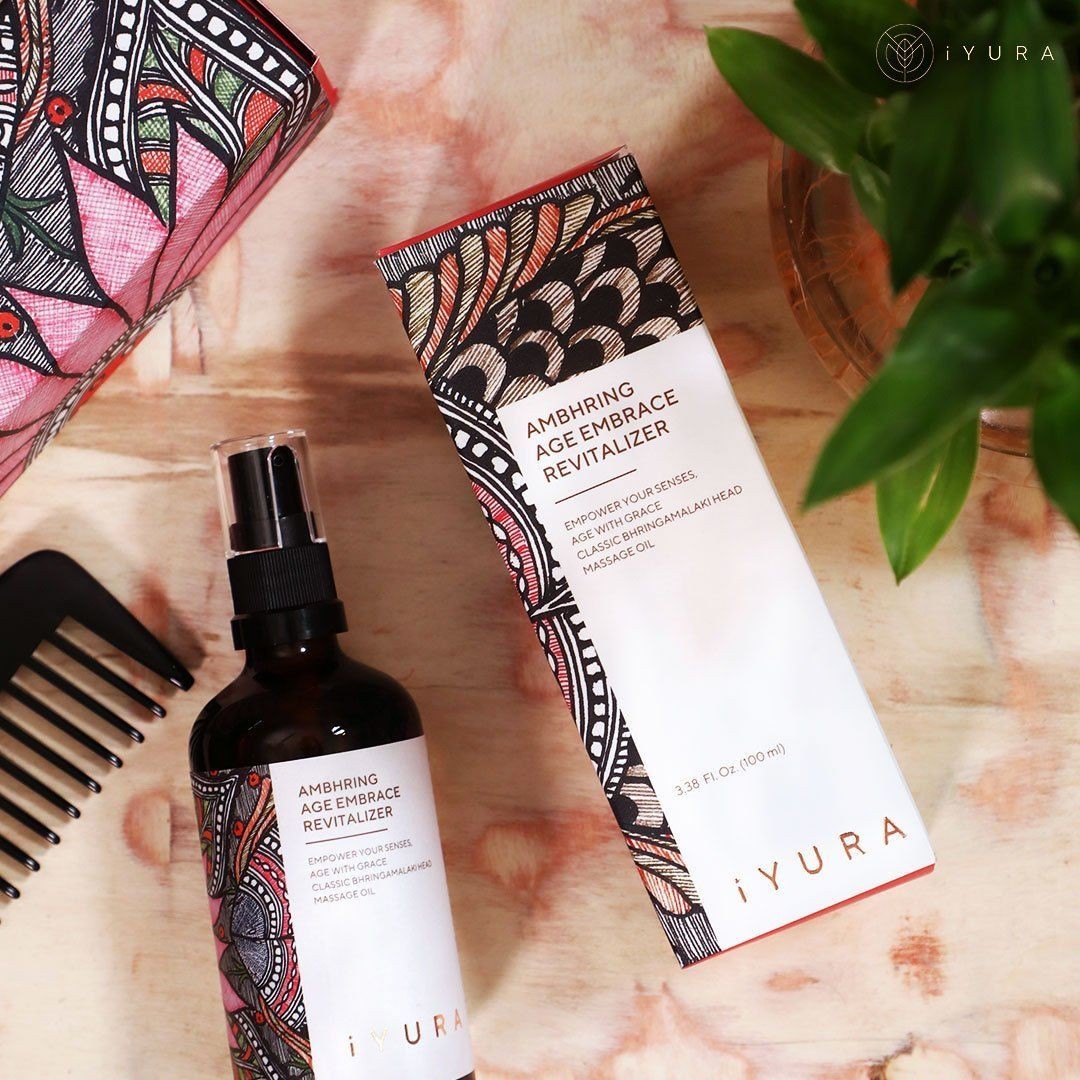 iYURA Ambhring with its beautiful Madhubani painting packaging and a comb.