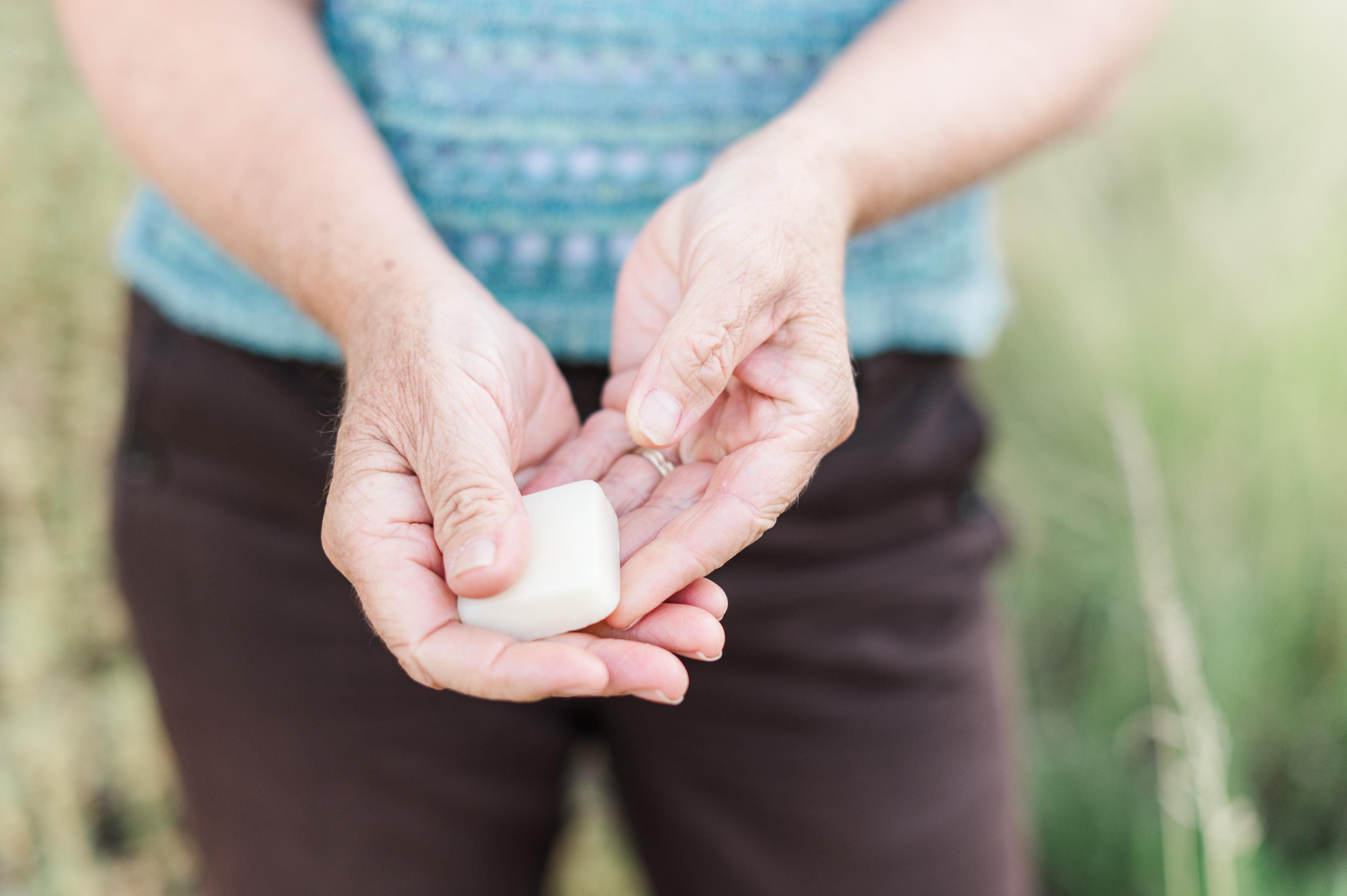 Renee holding a lavender lotion bar