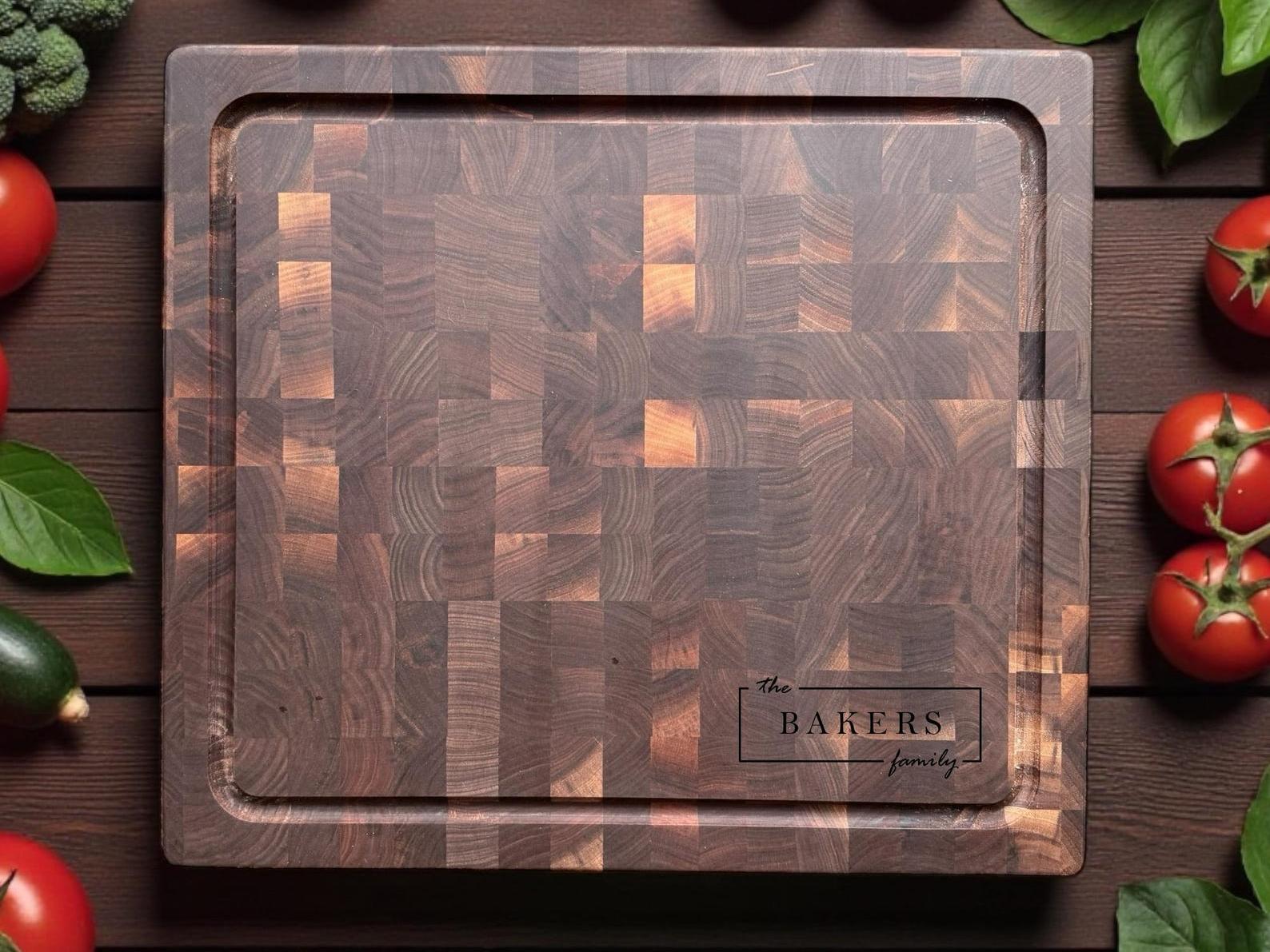 End grain walnut butcher block cutting board with rich checker pattern shown in kitchen with fresh vegetables