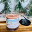 a brown brown sugar and fig candle with an rv on a christmas background. Shitters full